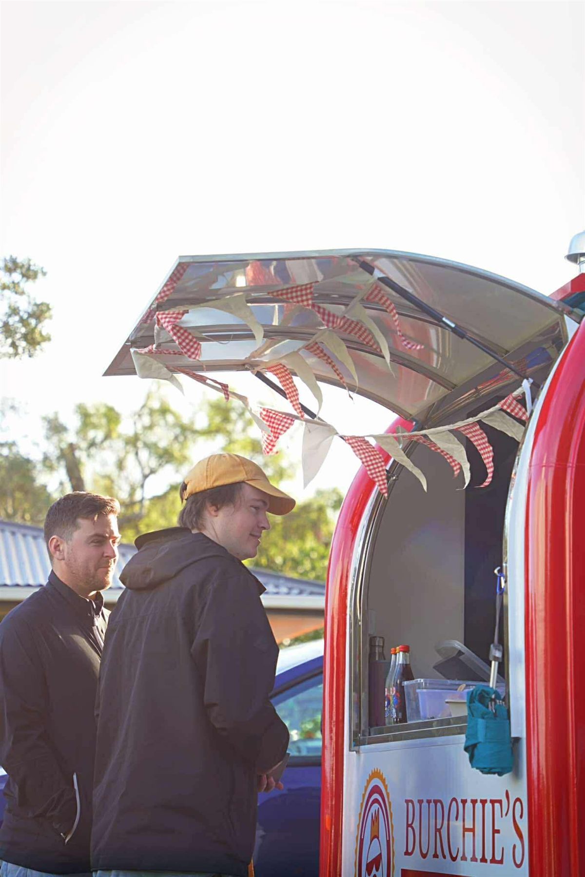People visiting the Burchie’s food trailer